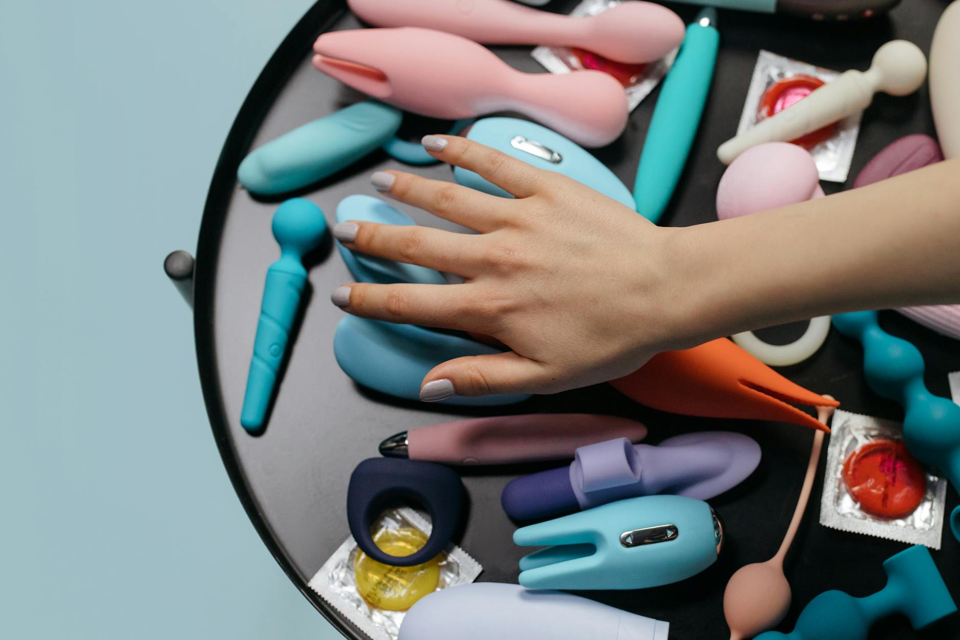 Ripe vivid lemons on a bright yellow background, symbolizing the lemon vibrator shape and cheerful brand identity.
