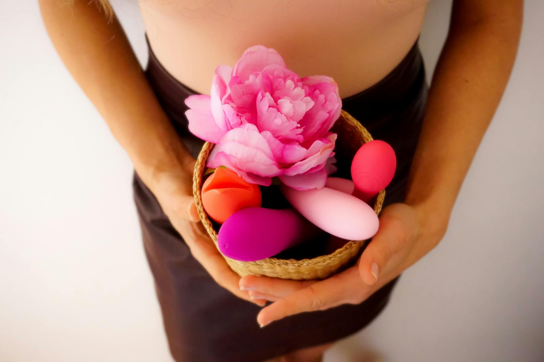 A collection of colorful vibrators and pleasure products arranged together, symbolizing diverse pleasure options during midlife transitions